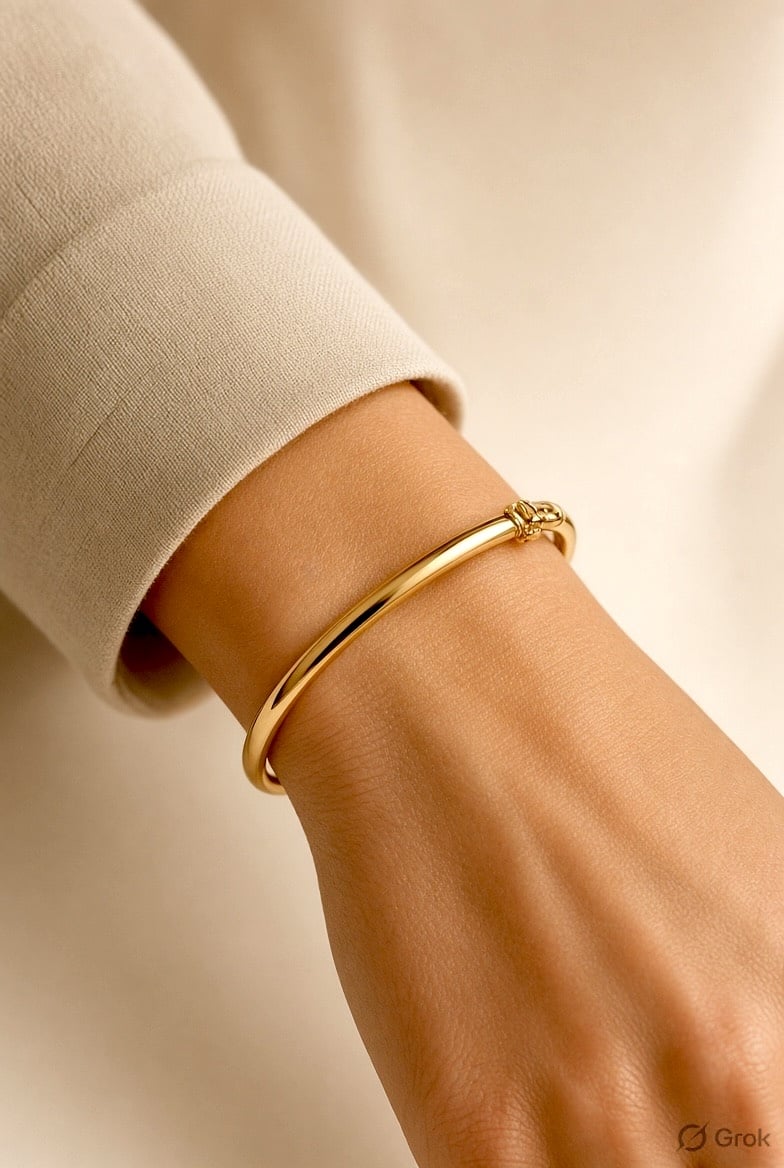 Woman wearing a gold bangle bracelet