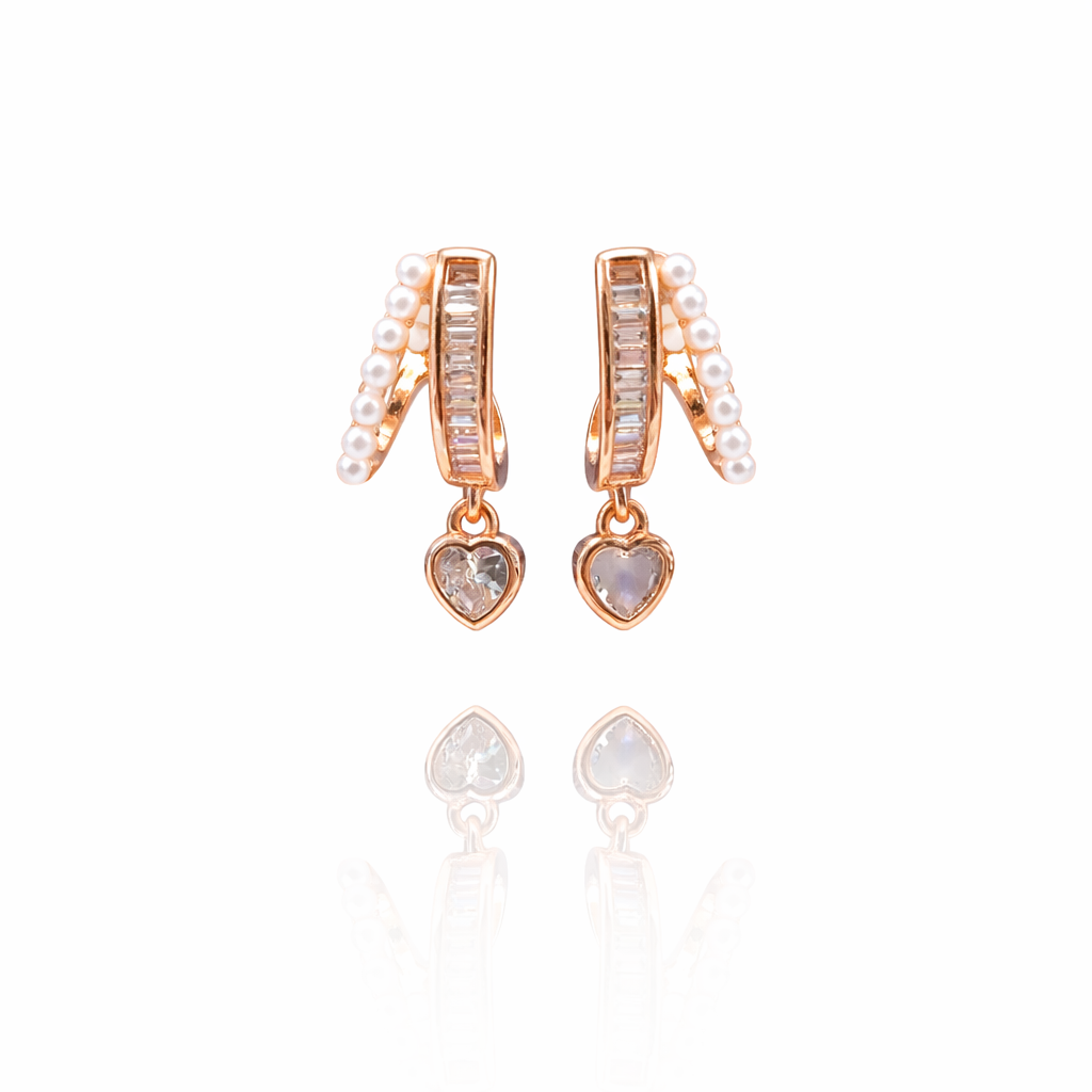 Rose gold plated split hoop earrings with pearl outer row, baguette inner row, and heart pendant drop